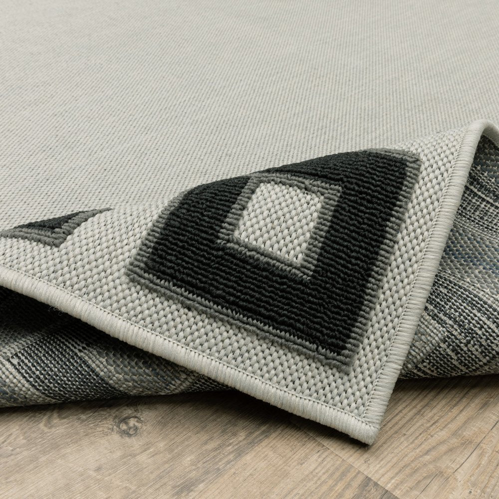 2' X 4' Beige and Black Stain Resistant Indoor Outdoor Area Rug
