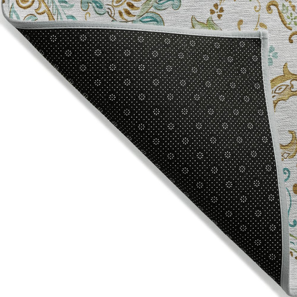 5' X 8' Ivory and Gold Paisley Washable Non Skid Indoor Outdoor Area Rug