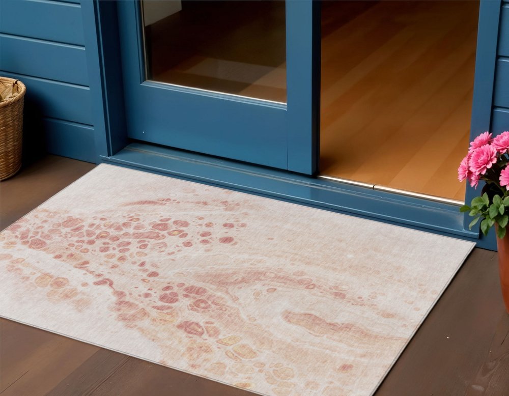 3' X 5' Salmon And Ivory Abstract Washable Indoor Outdoor Area Rug