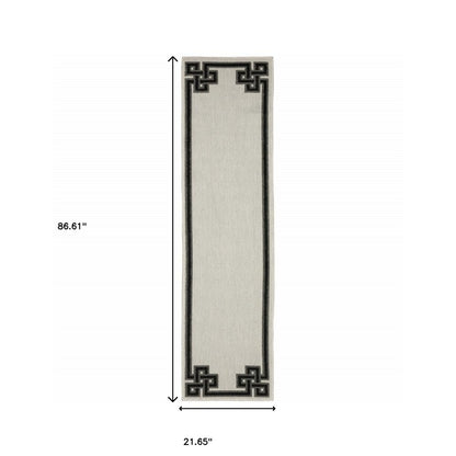 2' X 4' Beige and Black Stain Resistant Indoor Outdoor Area Rug