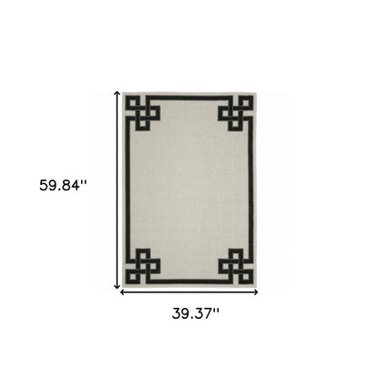 2' X 4' Beige and Black Stain Resistant Indoor Outdoor Area Rug