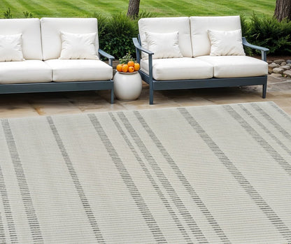 3' X 5' Cream and Beige Striped Distressed Indoor Outdoor Area Rug