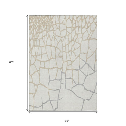 3' X 5' Ivory And Beige Abstract Washable Indoor Outdoor Area Rug