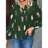 Elegant chiffon blouse with feather pattern—long sleeves and stylish design for a chic look.