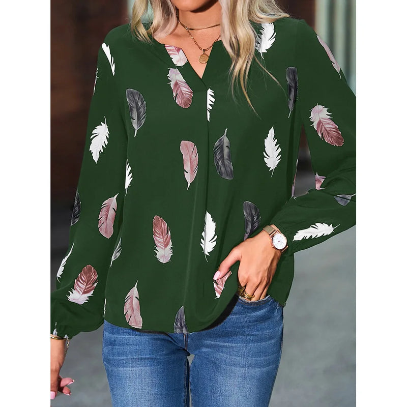 Elegant chiffon blouse with feather pattern—long sleeves and stylish design for a chic look.