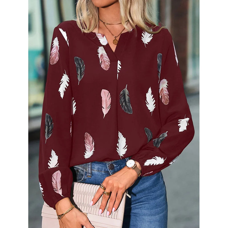 Elegant chiffon blouse with feather pattern—long sleeves and stylish design for a chic look.