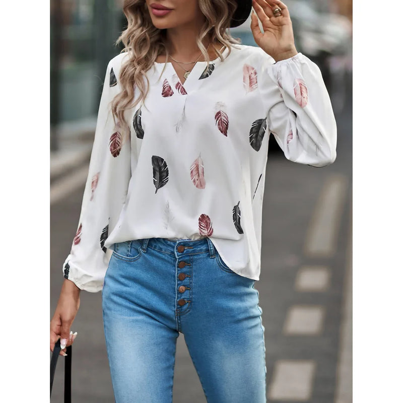 Elegant chiffon blouse with feather pattern—long sleeves and stylish design for a chic look.