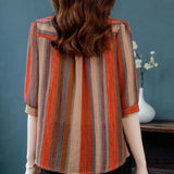 Elegant floral O-neck top with three-quarter sleeves—vintage-inspired, stylish, and perfect for summer.