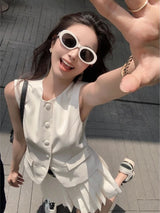 chic two-piece set—sleeveless tunic vest with high-waist pleated mini skirt, perfect for Korean summer