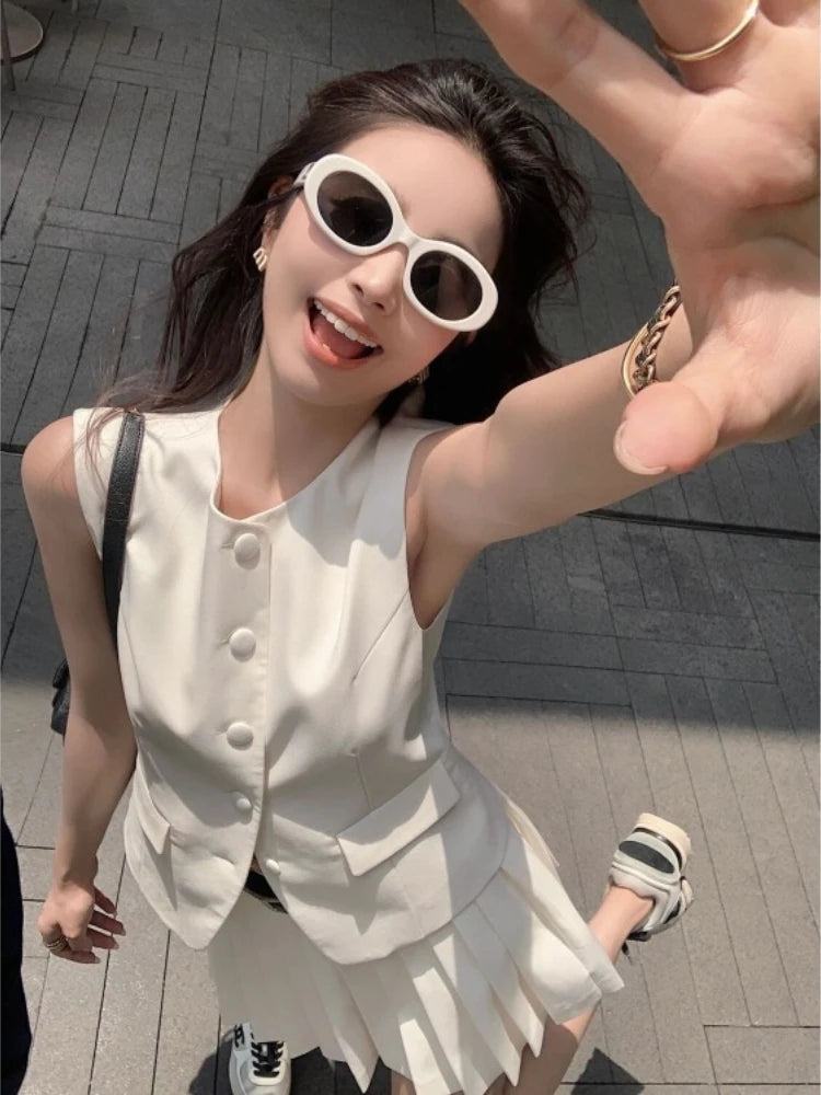 chic two-piece set—sleeveless tunic vest with high-waist pleated mini skirt, perfect for Korean summer