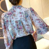 Elegant floral O-neck top with three-quarter sleeves—vintage-inspired, stylish, and perfect for summer.