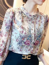 Elegant floral O-neck top with three-quarter sleeves—vintage-inspired, stylish, and perfect for summer.