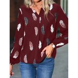 Elegant chiffon blouse with feather pattern—long sleeves and stylish design for a chic look.