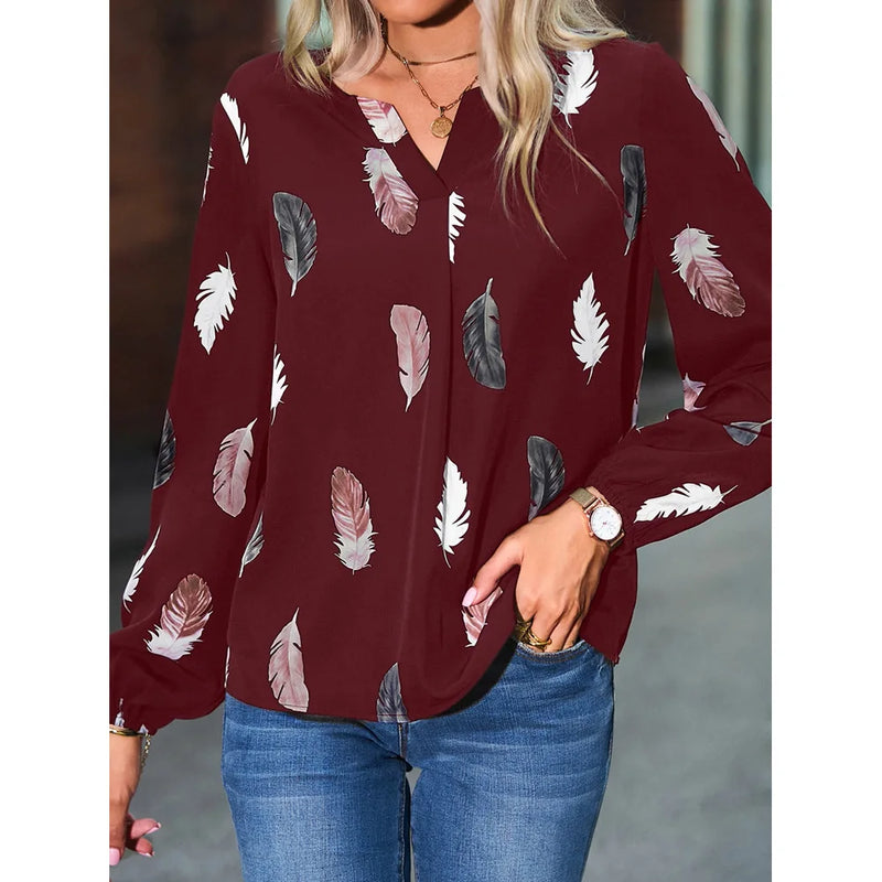 Elegant chiffon blouse with feather pattern—long sleeves and stylish design for a chic look.