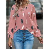 Elegant chiffon blouse with feather pattern—long sleeves and stylish design for a chic look.