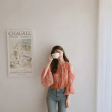 Elegant off-shoulder chiffon blouse—long sleeves and stylish design for a feminine, modern look.