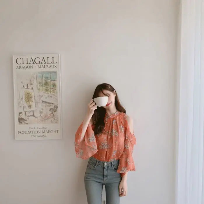 Elegant off-shoulder chiffon blouse—long sleeves and stylish design for a feminine, modern look.