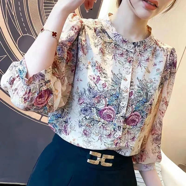Elegant floral O-neck top with three-quarter sleeves—vintage-inspired, stylish, and perfect for summer.