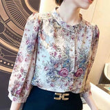 Elegant floral O-neck top with three-quarter sleeves—vintage-inspired, stylish, and perfect for summer.
