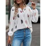 Elegant chiffon blouse with feather pattern—long sleeves and stylish design for a chic look.