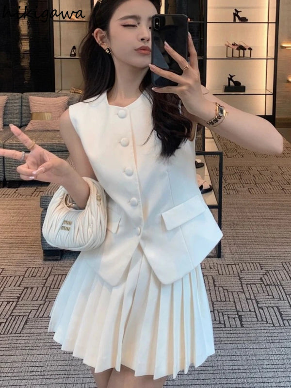 chic two-piece set—sleeveless tunic vest with high-waist pleated mini skirt, perfect for Korean summer