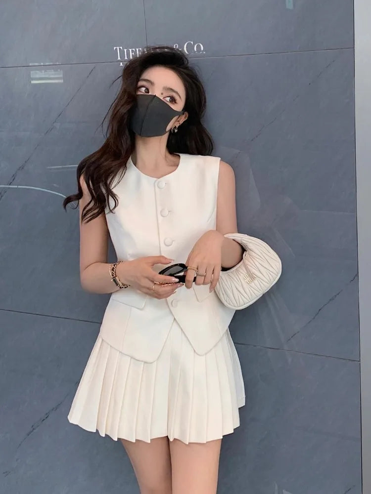chic two-piece set—sleeveless tunic vest with high-waist pleated mini skirt, perfect for Korean summer