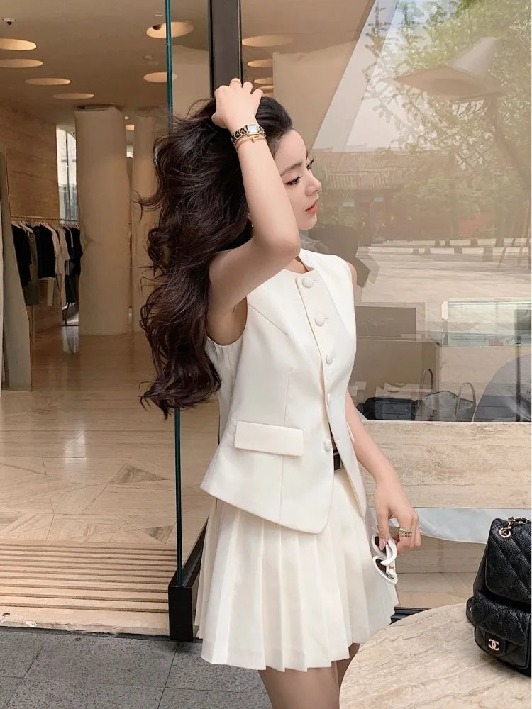 chic two-piece set—sleeveless tunic vest with high-waist pleated mini skirt, perfect for Korean summer