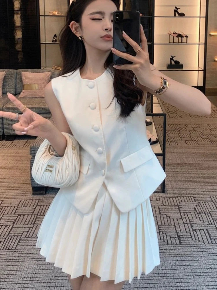 chic two-piece set—sleeveless tunic vest with high-waist pleated mini skirt, perfect for Korean summer