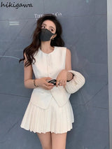 chic two-piece set—sleeveless tunic vest with high-waist pleated mini skirt, perfect for Korean summer
