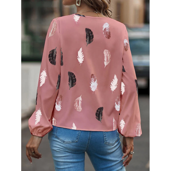 Elegant chiffon blouse with feather pattern—long sleeves and stylish design for a chic look.