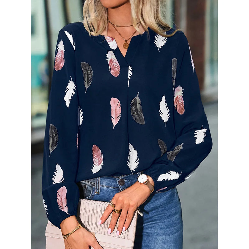 Elegant chiffon blouse with feather pattern—long sleeves and stylish design for a chic look.