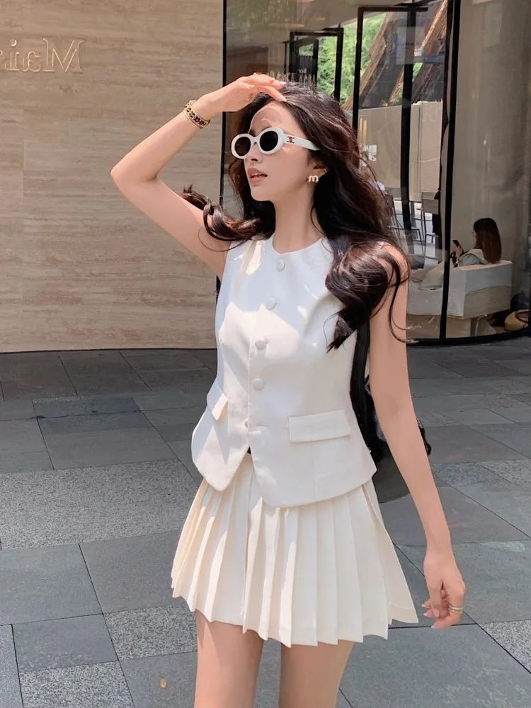 chic two-piece set—sleeveless tunic vest with high-waist pleated mini skirt, perfect for Korean summer