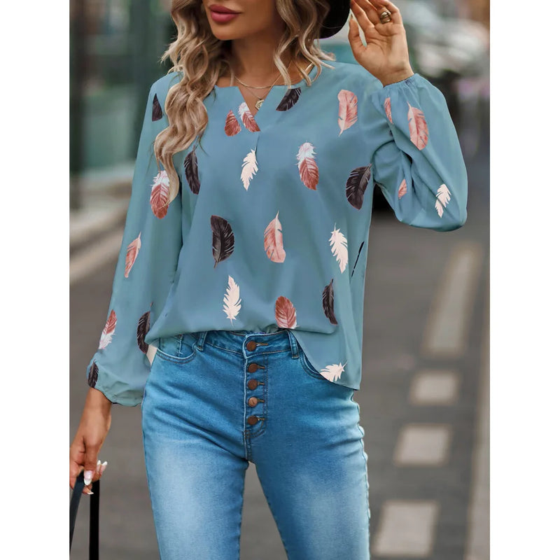Elegant chiffon blouse with feather pattern—long sleeves and stylish design for a chic look.