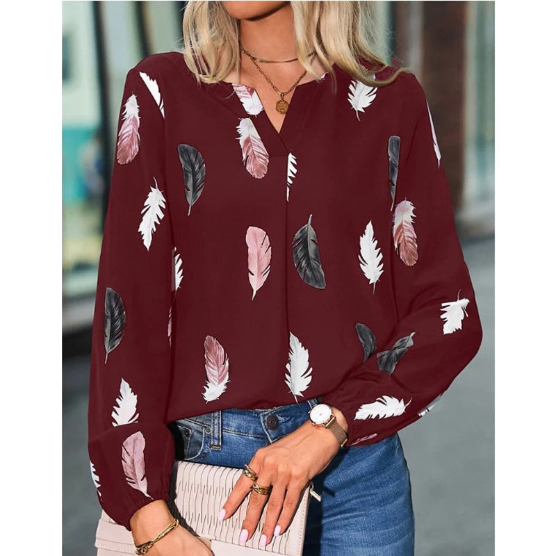 Elegant chiffon blouse with feather pattern—long sleeves and stylish design for a chic look.