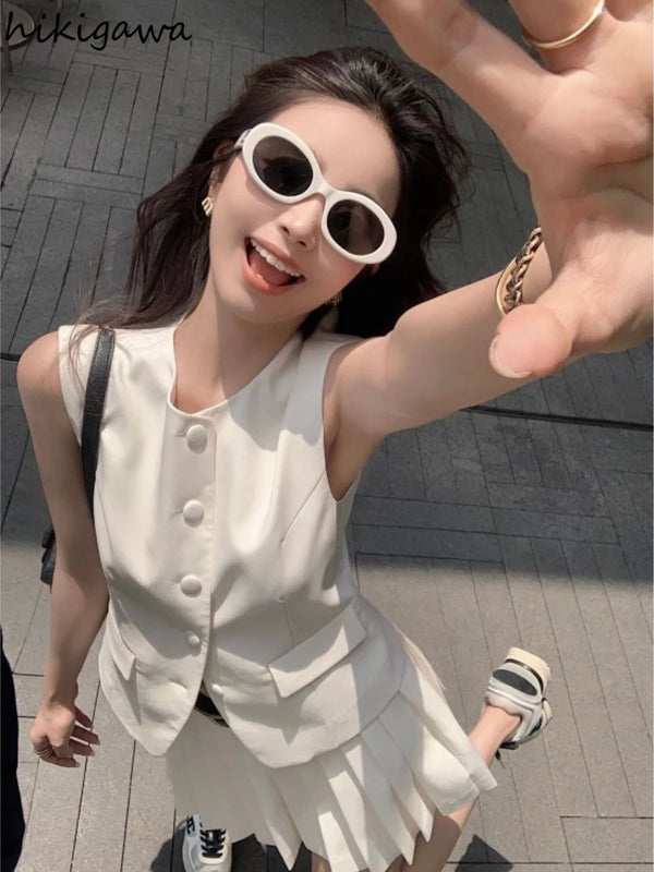 chic two-piece set—sleeveless tunic vest with high-waist pleated mini skirt, perfect for Korean summer