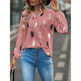 Elegant chiffon blouse with feather pattern—long sleeves and stylish design for a chic look.