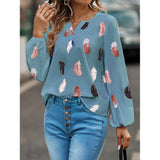 Elegant chiffon blouse with feather pattern—long sleeves and stylish design for a chic look.