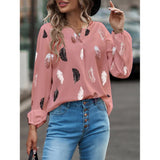Elegant chiffon blouse with feather pattern—long sleeves and stylish design for a chic look.