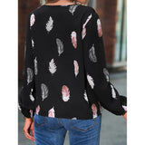 Elegant chiffon blouse with feather pattern—long sleeves and stylish design for a chic look.