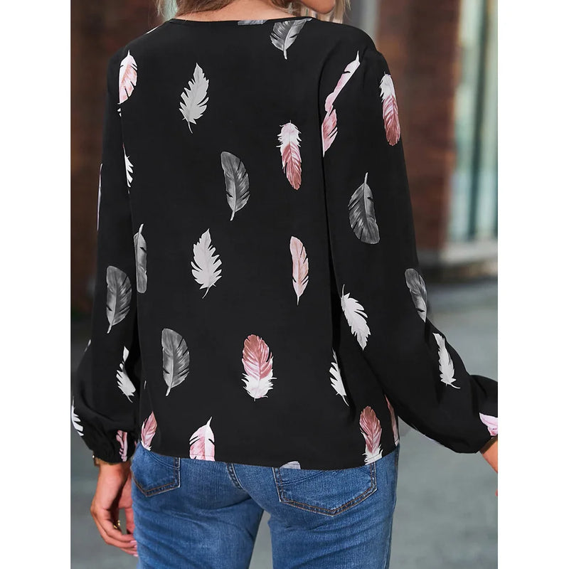Elegant chiffon blouse with feather pattern—long sleeves and stylish design for a chic look.
