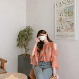 Elegant off-shoulder chiffon blouse—long sleeves and stylish design for a feminine, modern look.