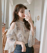 Elegant off-shoulder chiffon blouse—long sleeves and stylish design for a feminine, modern look.