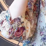 Elegant floral O-neck top with three-quarter sleeves—vintage-inspired, stylish, and perfect for summer.