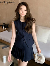 chic two-piece set—sleeveless tunic vest with high-waist pleated mini skirt, perfect for Korean summer