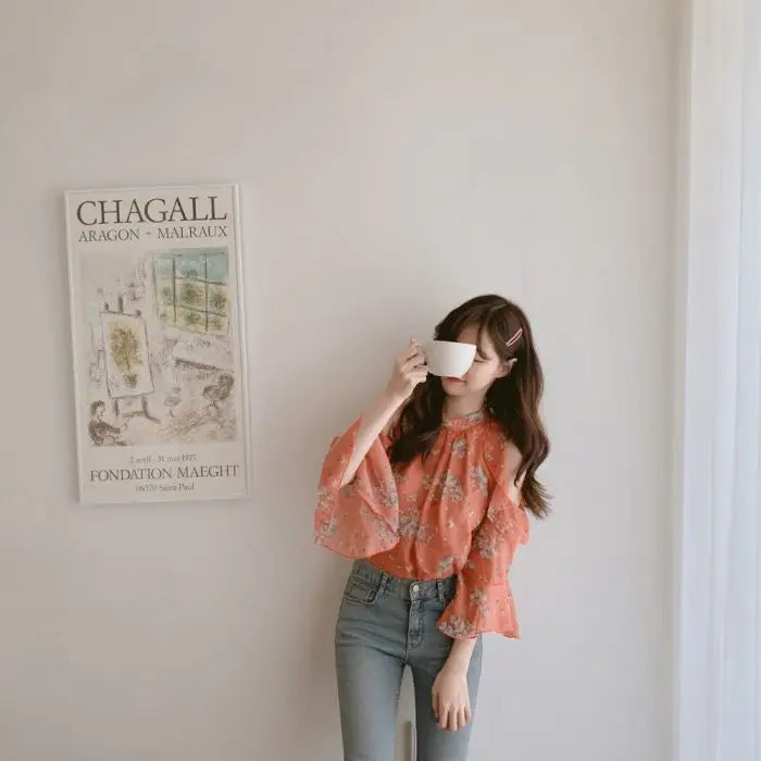 Elegant off-shoulder chiffon blouse—long sleeves and stylish design for a feminine, modern look.