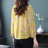 Elegant floral O-neck top with three-quarter sleeves—vintage-inspired, stylish, and perfect for summer.