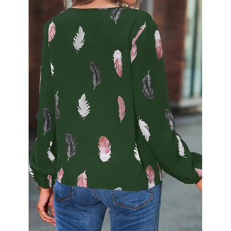 Elegant chiffon blouse with feather pattern—long sleeves and stylish design for a chic look.