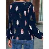 Elegant chiffon blouse with feather pattern—long sleeves and stylish design for a chic look.
