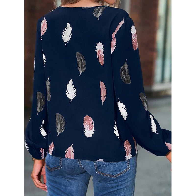 Elegant chiffon blouse with feather pattern—long sleeves and stylish design for a chic look.