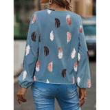 Elegant chiffon blouse with feather pattern—long sleeves and stylish design for a chic look.